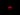 A glowing red cylindrical object is centered against a completely black background.